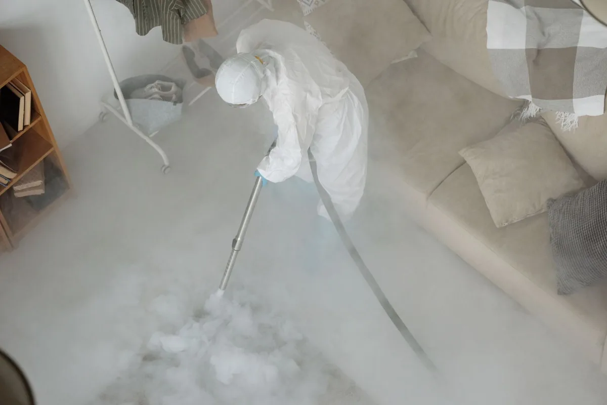 Biohazard cleanup technician in protective equipment, Riverside, AL